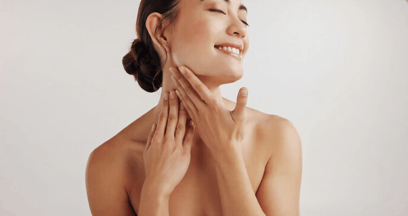 Smiling woman with even, glowing skin after precision dark spot treatment